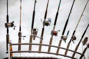 row of fishing rods on ship