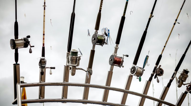 row of fishing rods on ship