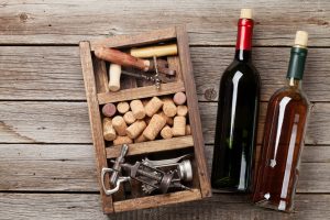 Wine bottles, corkscrew and corks