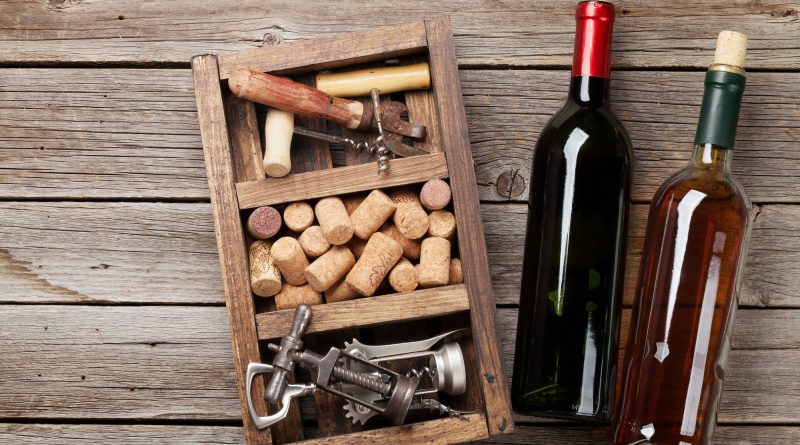 Wine bottles, corkscrew and corks