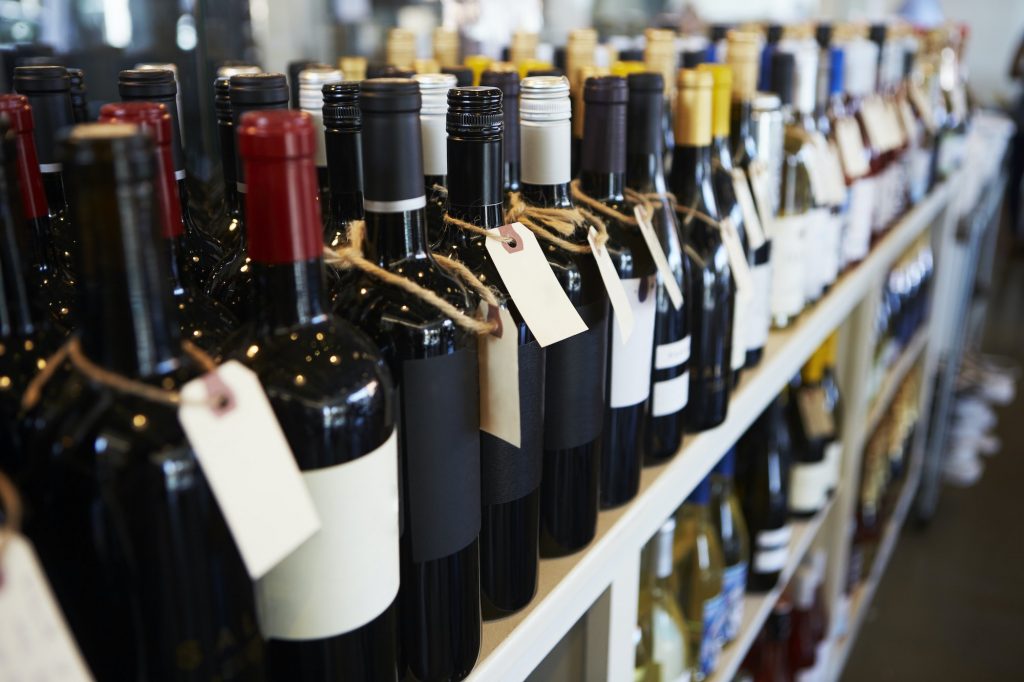 Bottles Of Wine On Display In Delicatessen