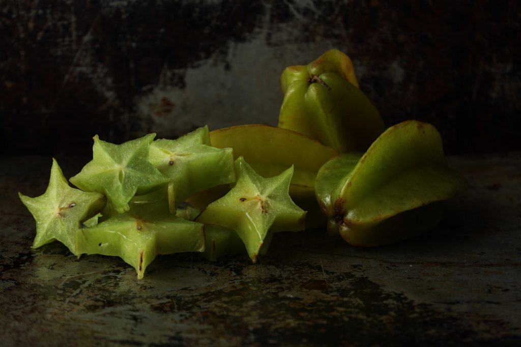 Carambola-star fruit on dark background