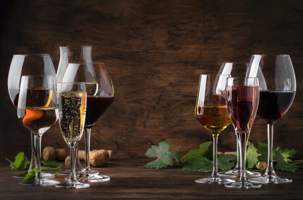 Red, white wine, rose and champagne in wine glasses