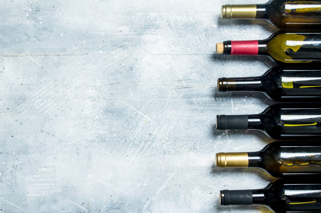 Wine background. Bottles of red and white wine.