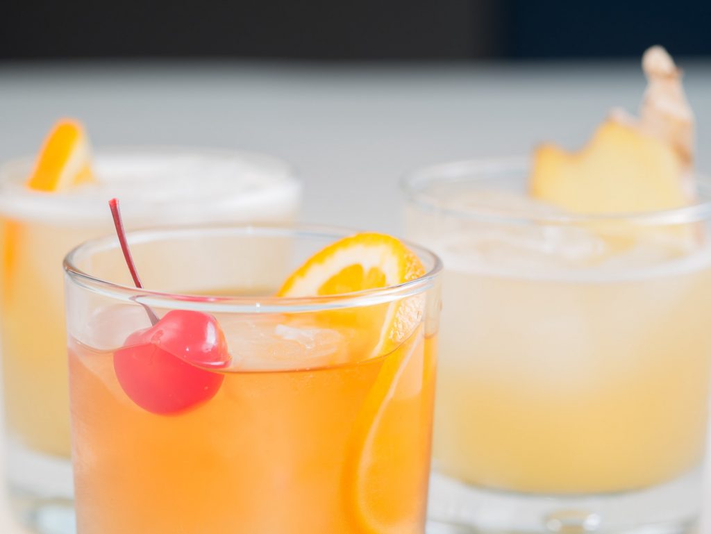 Orange cocktails with cherry