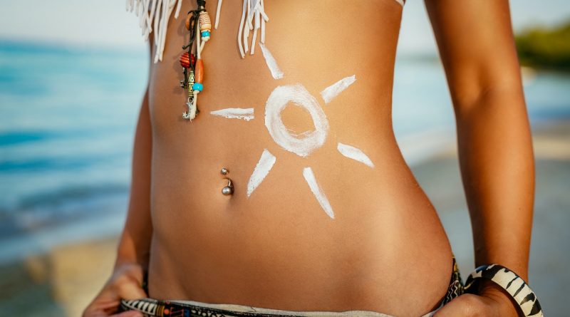 Woman Body With Sun Shaped Sun Cream