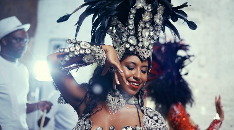 Shot of a beautiful samba dancer performing in a carnival with her band