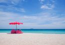 Pink parasol and seat on the tropical beach