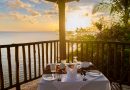dinner table during sunset, romantic dinner by ocean watching the beautiful Caribbean ocean