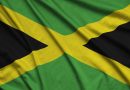 Jamaica flag is depicted on a sports cloth fabric with many folds. Sport team waving banner