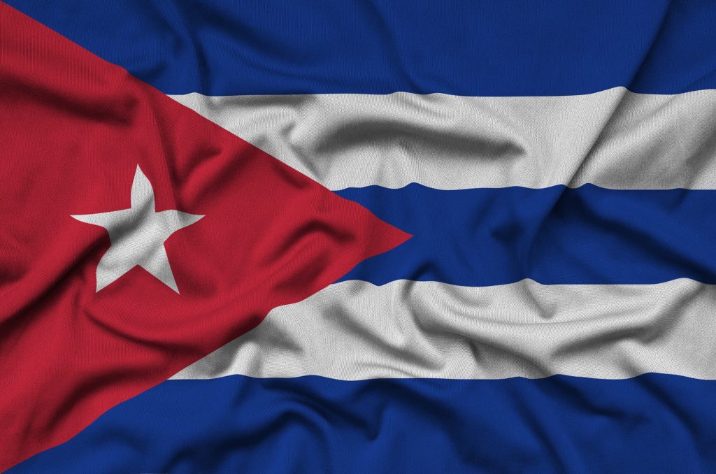 Cuba flag is depicted on a sports cloth fabric with many folds. Sport team waving banner