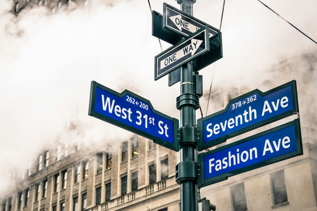 Modern street sign and vapor steam in New York City