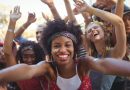 Cheerful young woman enjoying at music festival