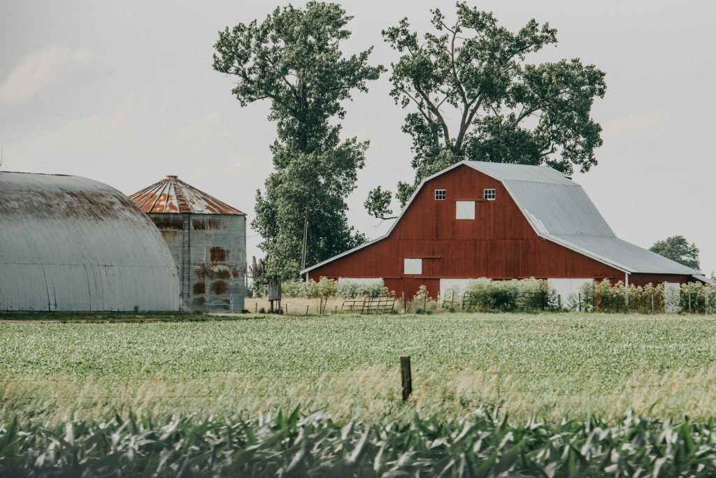 Landscape view of a red barn on a farm in Indiana